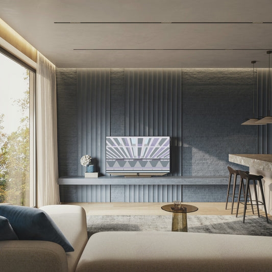 Animated mockup of the Ordre Minimal wallpaper collection on a TV in a modern living room with a dark blue, textured feature wall. On the screen, a slideshow of the "Place-des-Arts: The Brutalist Threshold" illustration cycles through its twelve different colour themes, including the theatrical Curtain Call, the nostalgic St-Viateur Sesame, and the vibrant Outdoor Fest.