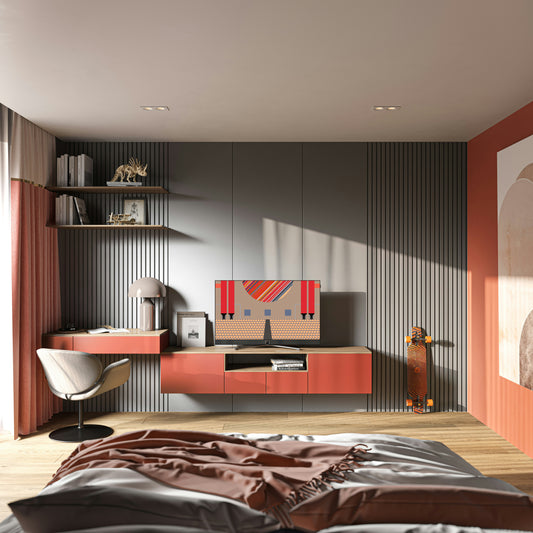 Animated mockup of the Ordre Minimal wallpaper collection displayed on a TV in a modern living room. The room features a minimalist desk and shelving against a dark, slatted wall. On the TV screen, an animated slideshow smoothly transitions between different colour themes of the "Peel: Graphic Circles" illustration, showcasing palettes like the vibrant Classic '66, the earthy Old Port, and the colourful Julep Sunrise